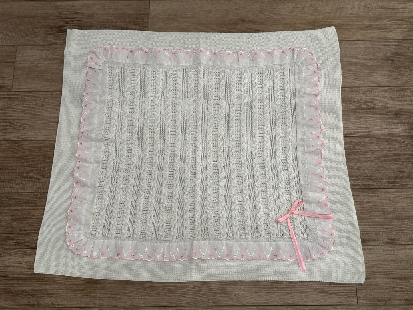 Soft Knitted Baby Blanket with Floral Accents